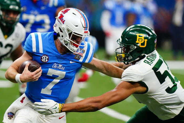Jan 1, 2022; New Orleans, LA, USA; Mississippi Rebels quarterback Luke Altmyer (7) runs with the ball against Baylor Bears linebacker Garmon Randolph (55) during the first half in the 2022 Sugar Bowl at Caesars Superdome. Mandatory Credit: John David Mercer-USA TODAY Sports